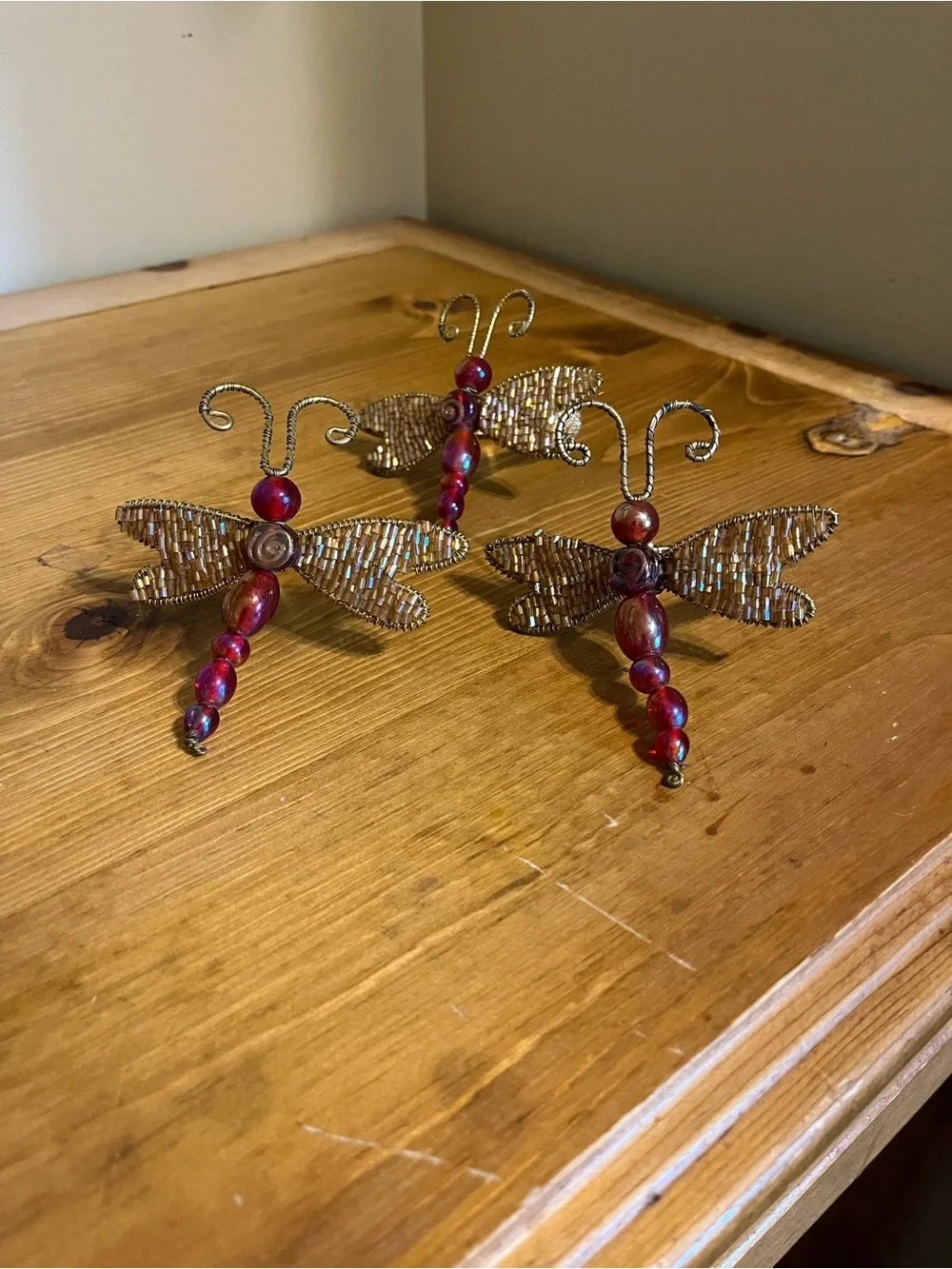 3 Pier one dragonfly napkin holders with glass red beads 3 1/2 x 3 1/2”